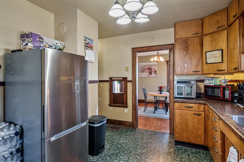 16905 West State Road Pecatonica, IL 61063 - Photo 16 of 36 a kitchen with stainless steel appliances granite countertop a refrigerator and a sink
