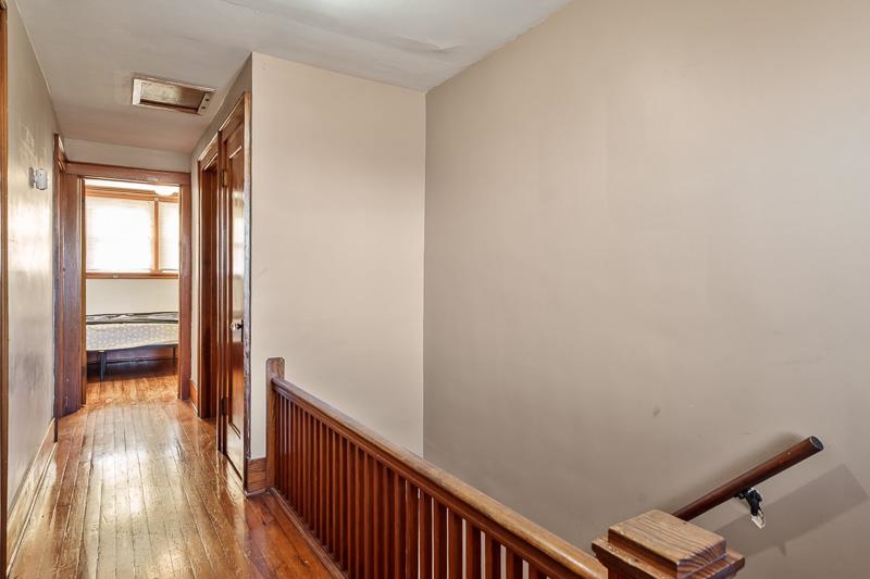 16905 West State Road Pecatonica, IL 61063 - Photo 21 of 36 a view of a hallway with wooden floor and closet