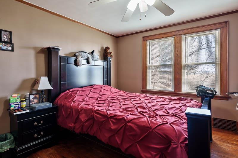 16905 West State Road Pecatonica, IL 61063 - Photo 26 of 36 a bedroom with a bed and wooden floor
