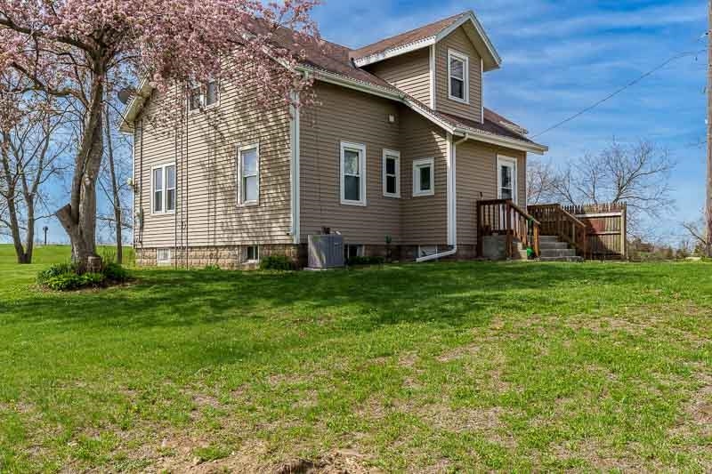 16905 West State Road Pecatonica, IL 61063 - Photo 32 of 47 a front view of house with yard and green space