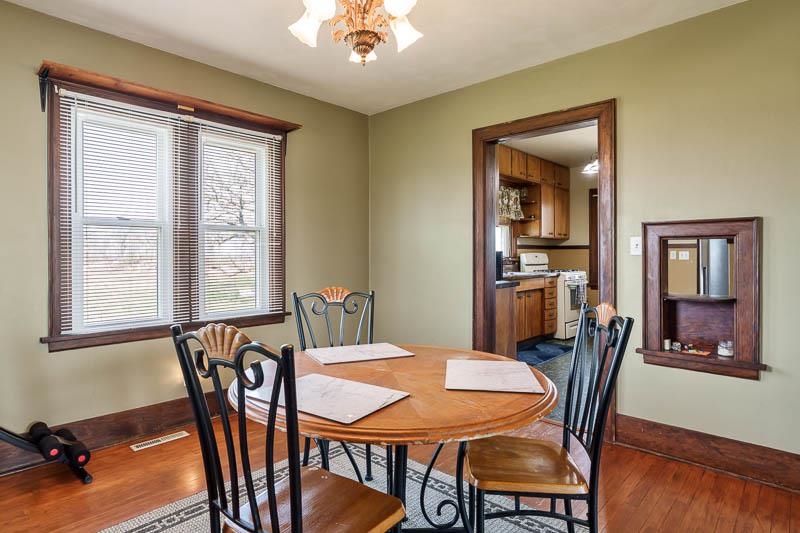 16905 West State Road Pecatonica, IL 61063 - Photo 10 of 47 a view of a dining room with furniture window and wooden floor