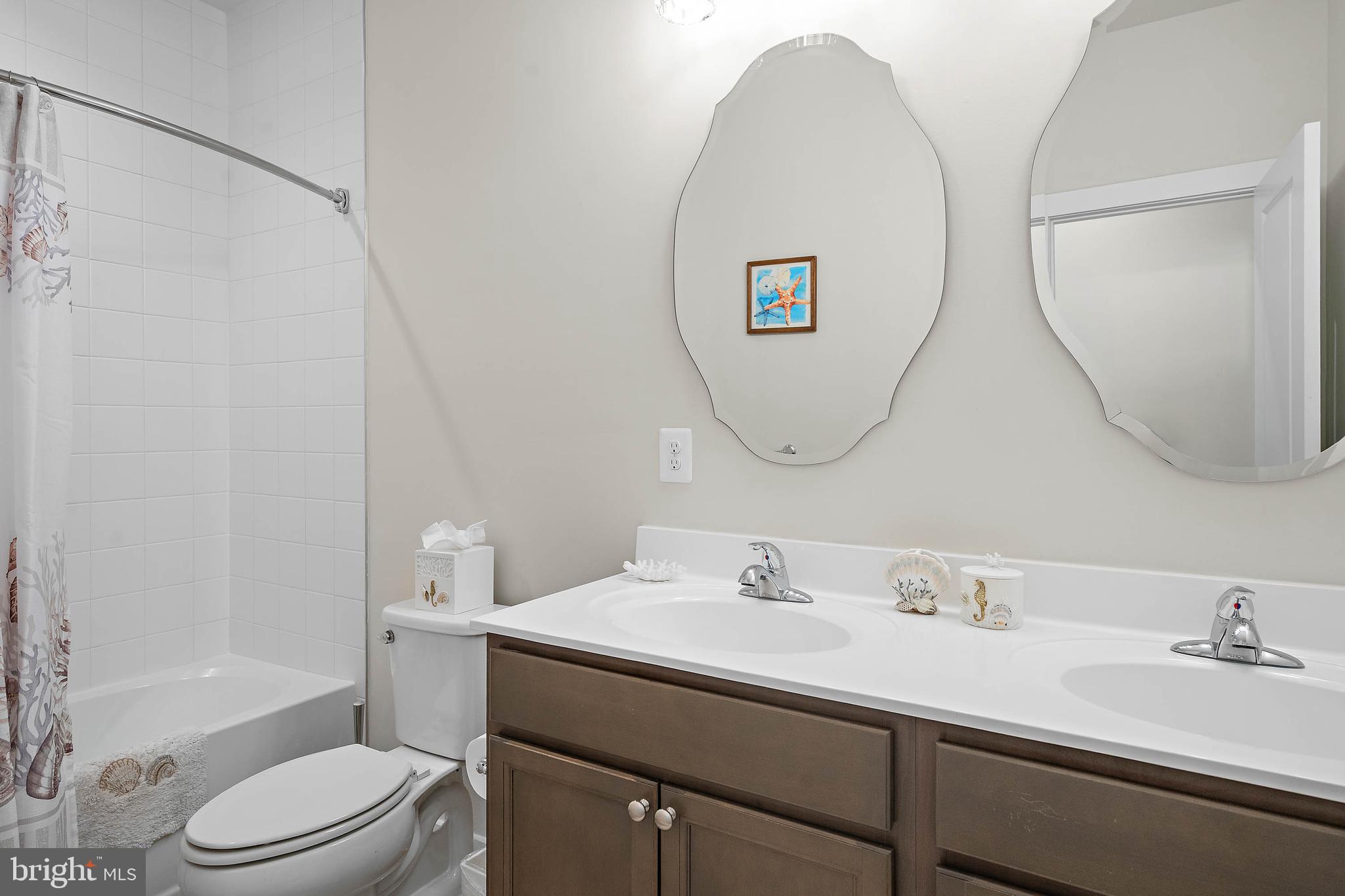 18565 Emerson Way Georgetown, DE 19947 - Photo 41 of 60 a bathroom with a sink mirror toilet and bathtub