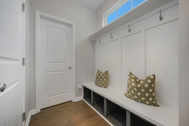 a room with storage and a shelf