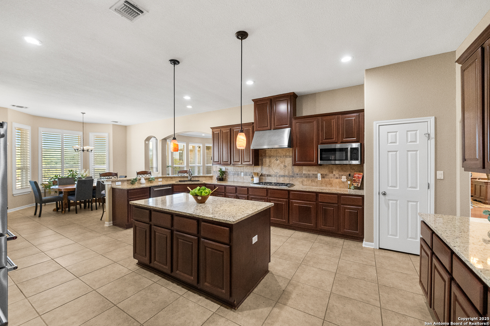 123 Dodder Lane Spring Branch, TX 78070 - Photo 18 of 72 a kitchen with a sink stove and cabinets