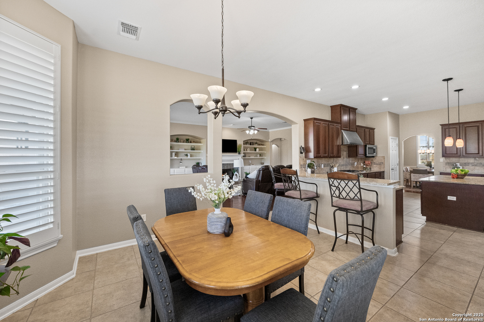123 Dodder Lane Spring Branch, TX 78070 - Photo 21 of 72 a view of a dining room with furniture and chandelier