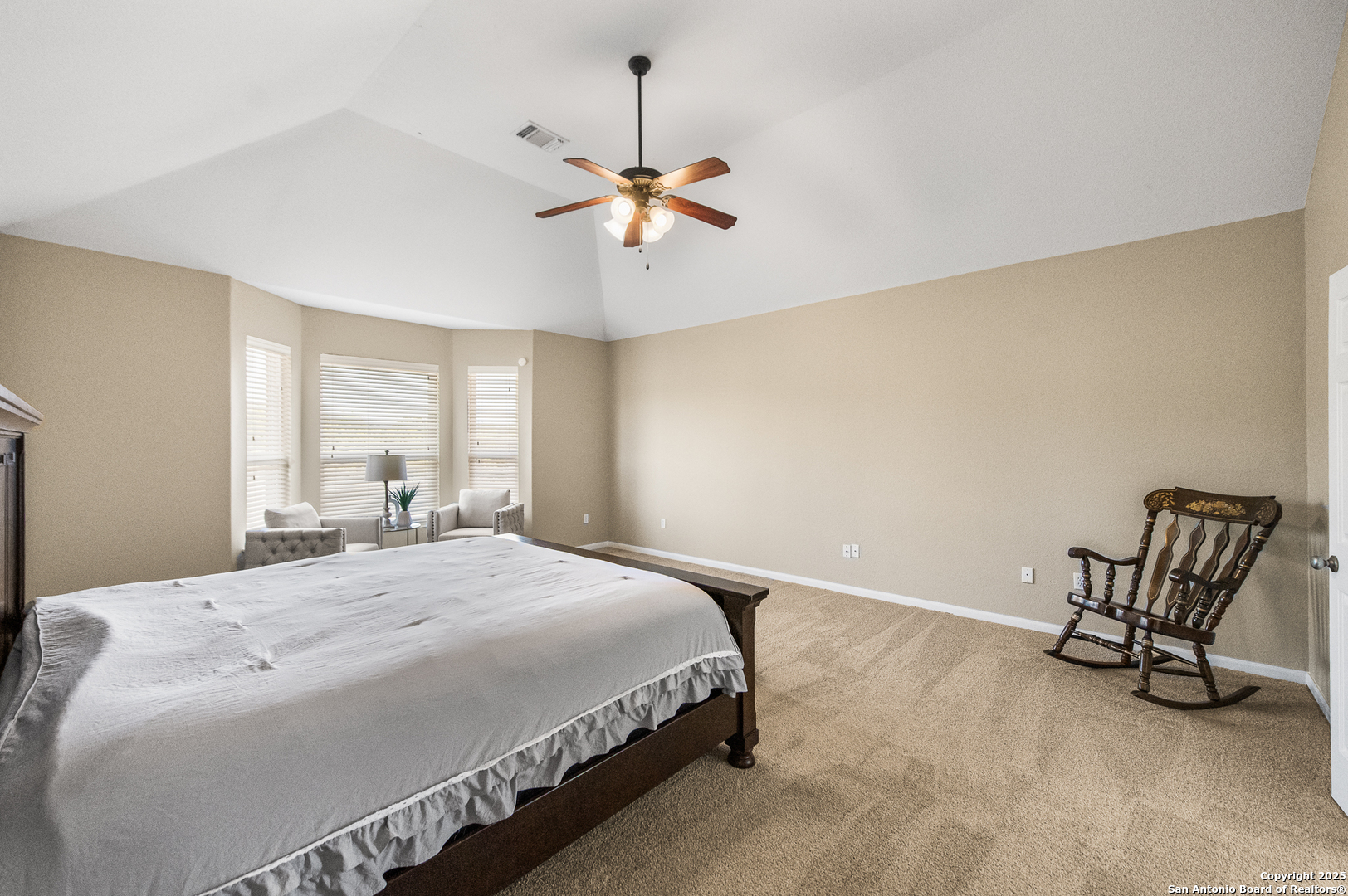 123 Dodder Lane Spring Branch, TX 78070 - Photo 30 of 72 a bedroom with a bed a chair and potted plant on the dresser