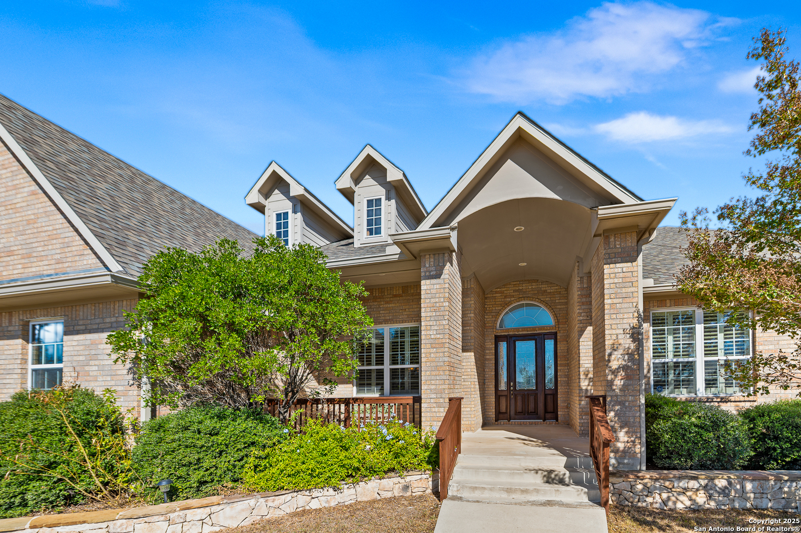 123 Dodder Lane Spring Branch, TX 78070 - Photo 3 of 72 a front view of a house with a yard