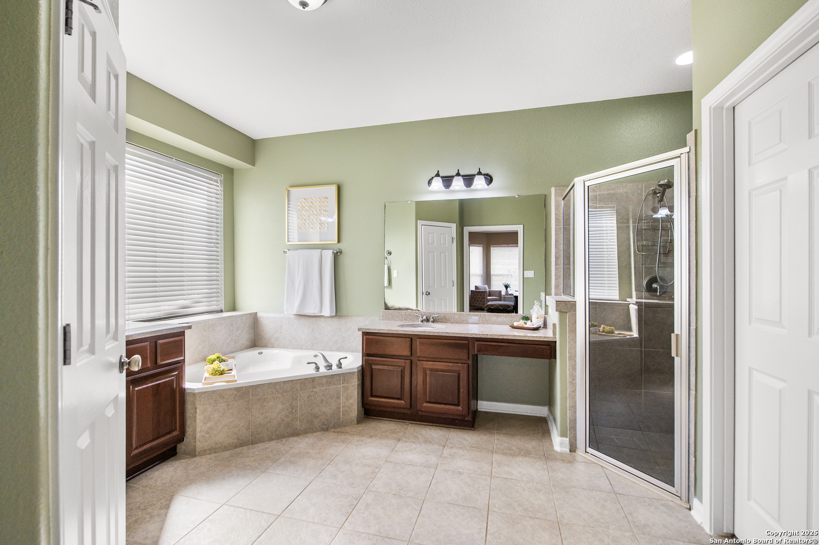 123 Dodder Lane Spring Branch, TX 78070 - Photo 32 of 72 a large bathroom with a tub sink and mirror