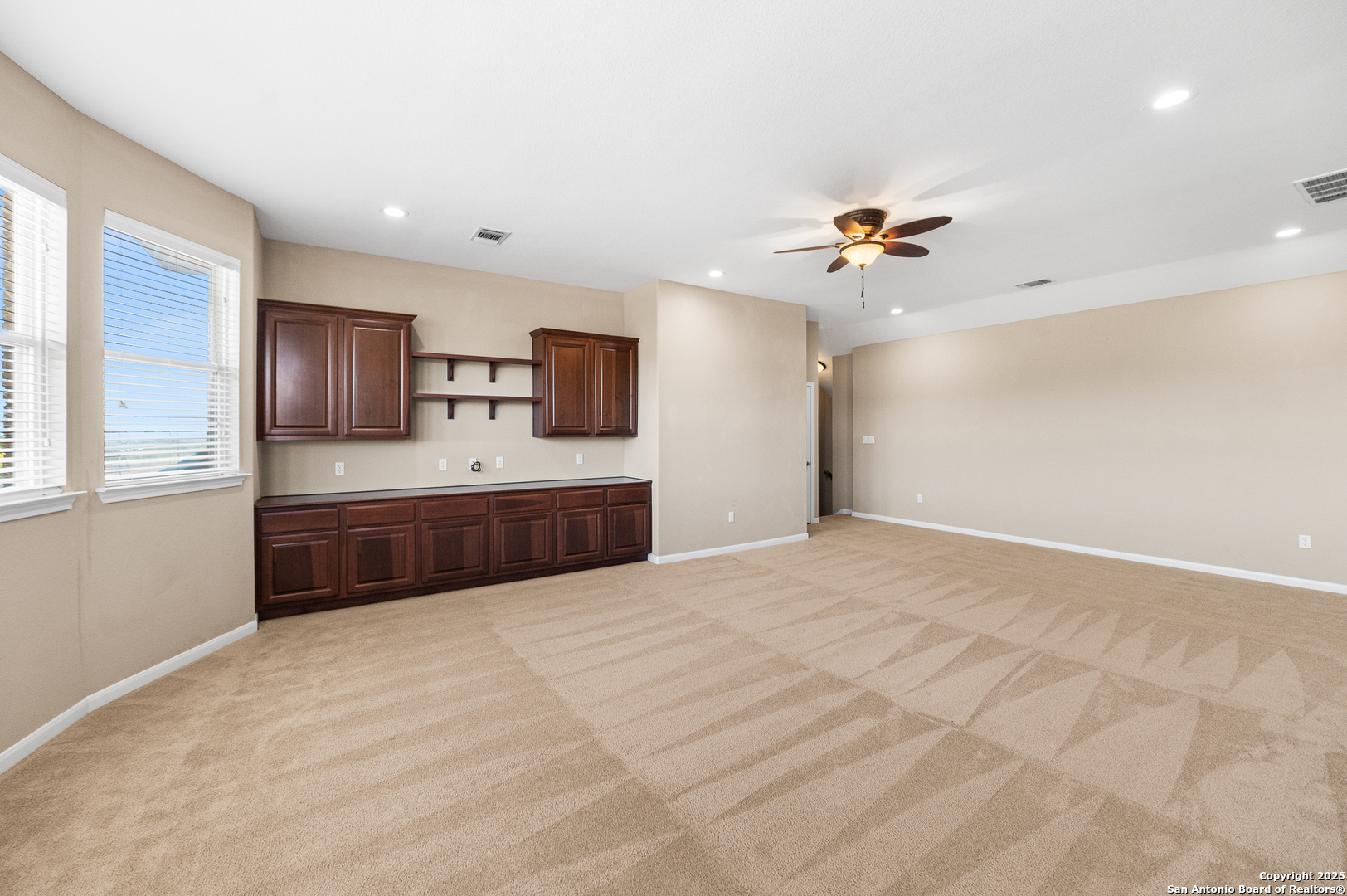 123 Dodder Lane Spring Branch, TX 78070 - Photo 36 of 72 a spacious bedroom with a bed and a chandelier