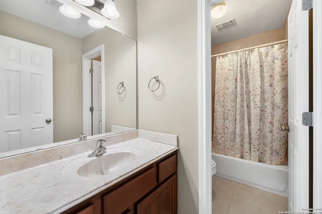 a view of house with swimming pool outdoor seating