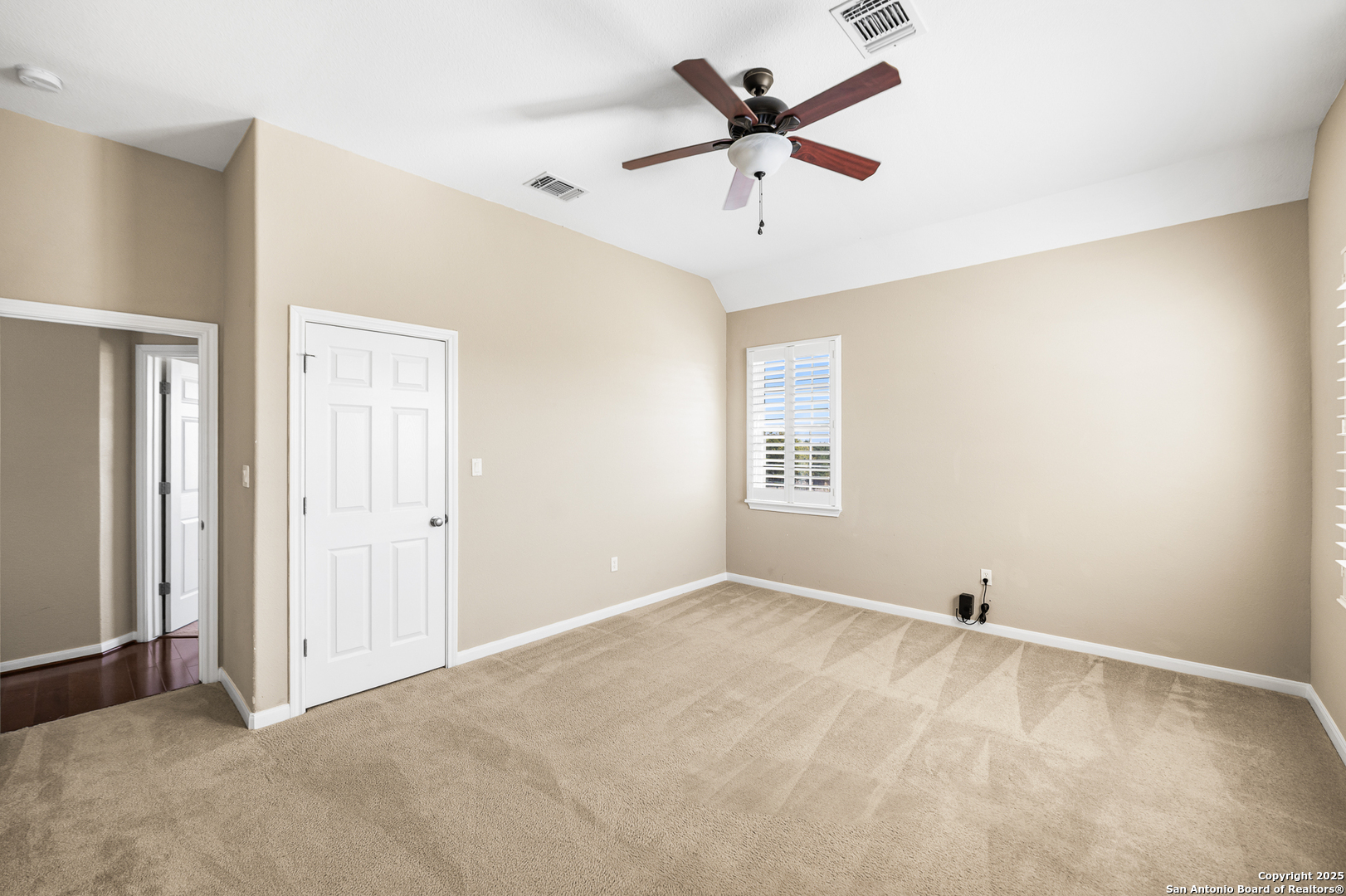 123 Dodder Lane Spring Branch, TX 78070 - Photo 43 of 72 an empty room with a ceiling fan and a window