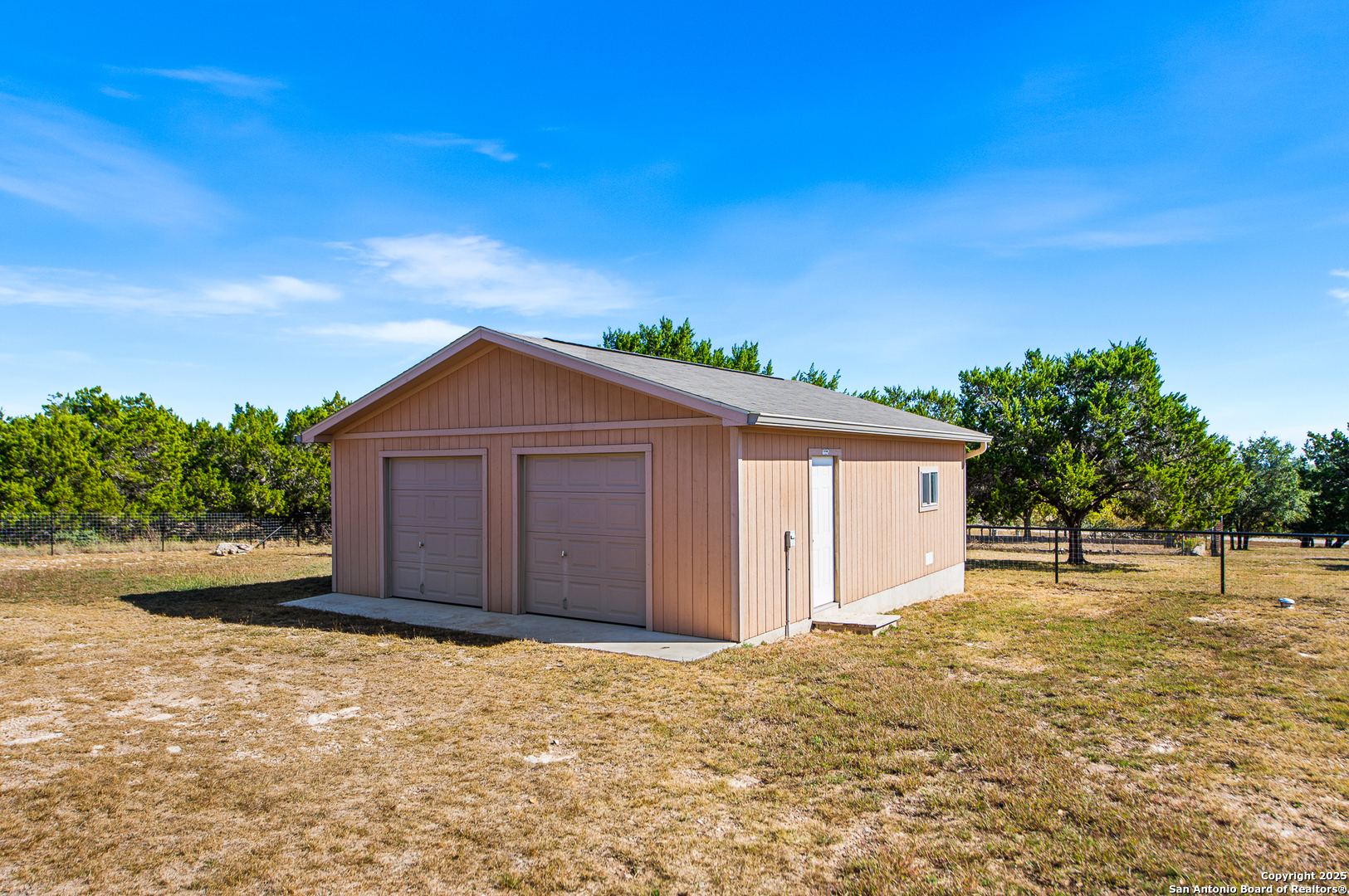 123 Dodder Lane Spring Branch, TX 78070 - Photo 45 of 72 a house view with a backyard space