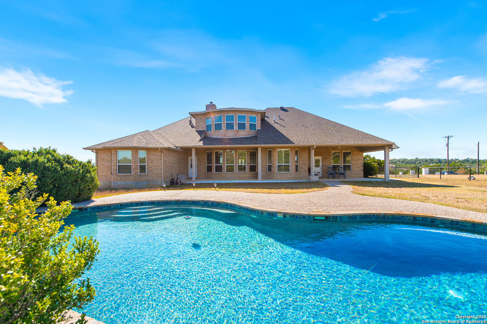 123 Dodder Lane Spring Branch, TX 78070 - Photo 49 of 72 a view of house with swimming pool outdoor seating
