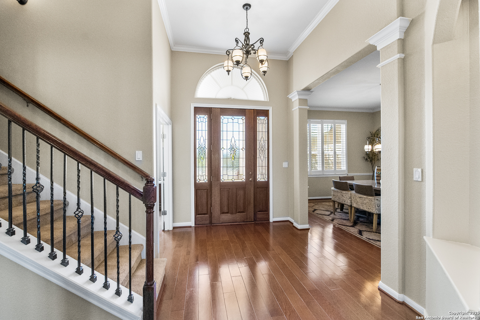 123 Dodder Lane Spring Branch, TX 78070 - Photo 5 of 72 a hallway with wooden floor chandelier and livingroom