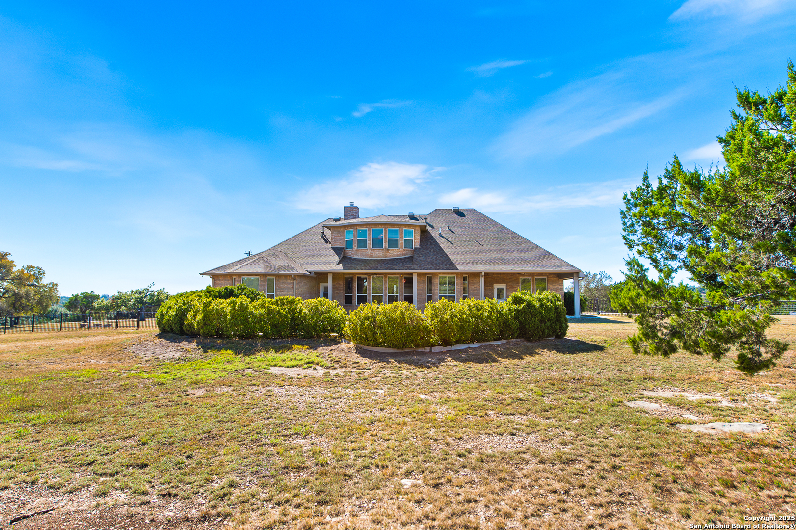 123 Dodder Lane Spring Branch, TX 78070 - Photo 57 of 72 a front view of a house with a yard and garage