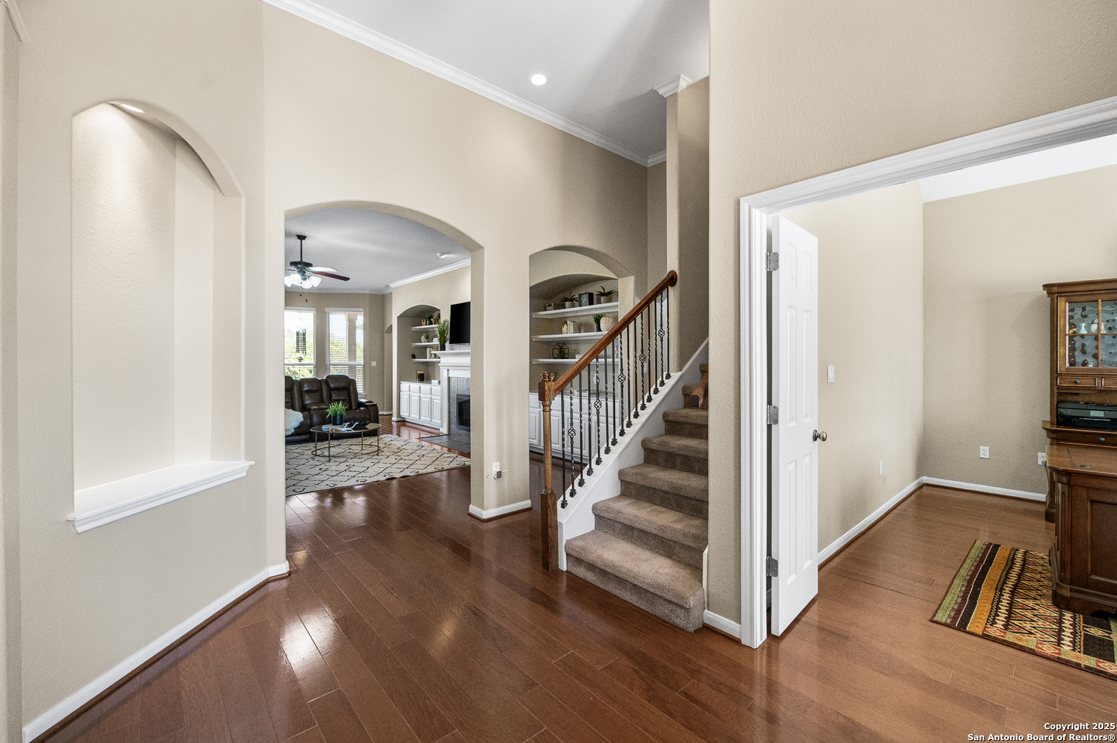 123 Dodder Lane Spring Branch, TX 78070 - Photo 7 of 72 a view of a hallway with wooden floor and staircase