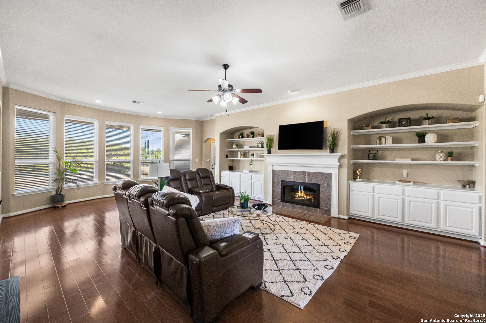 123 Dodder Lane Spring Branch, TX 78070 - Photo 9 of 72 a living room with furniture a fireplace and a flat screen tv