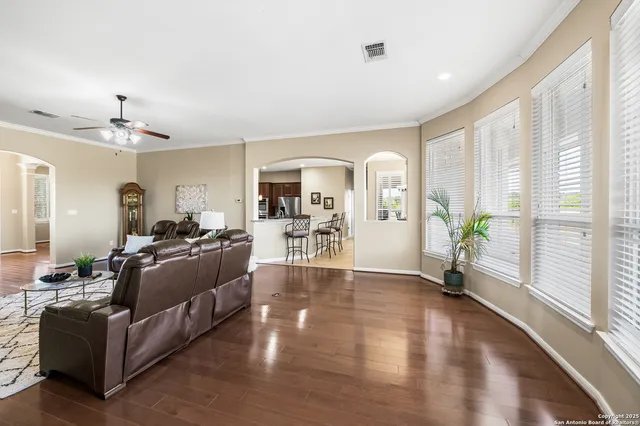 a living room with furniture fireplace and a flat screen tv