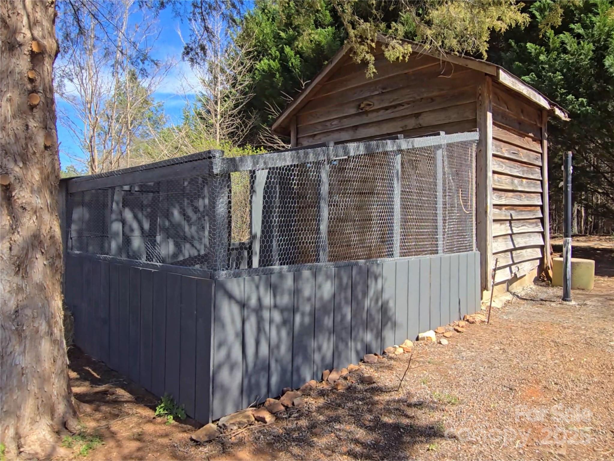 3531 Big Level Road Mill Spring, NC 28756 - Photo 19 of 29 a view of a house with a wooden fence