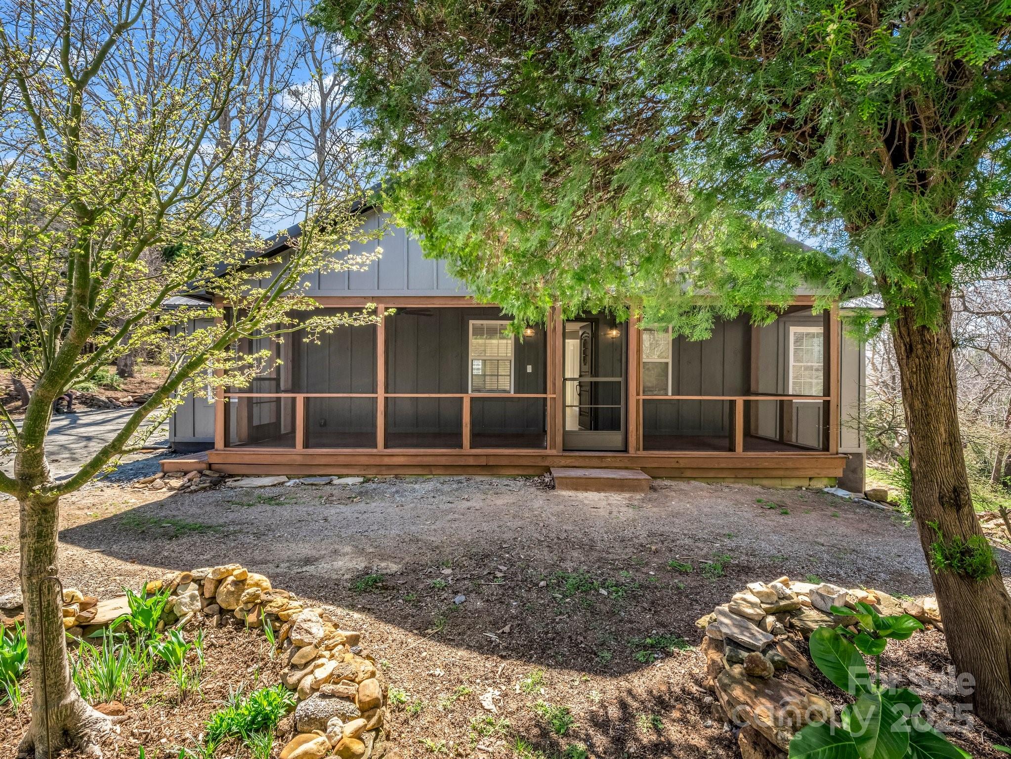 3531 Big Level Road Mill Spring, NC 28756 - Photo 2 of 29 a backyard of a house with barbeque oven