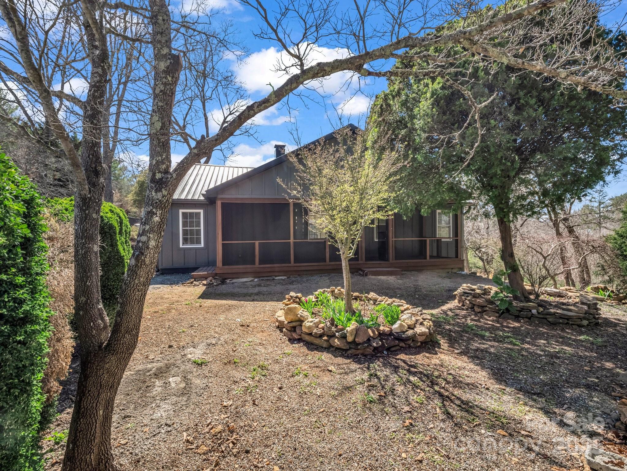 3531 Big Level Road Mill Spring, NC 28756 - Photo 23 of 29 a front view of a house with a yard