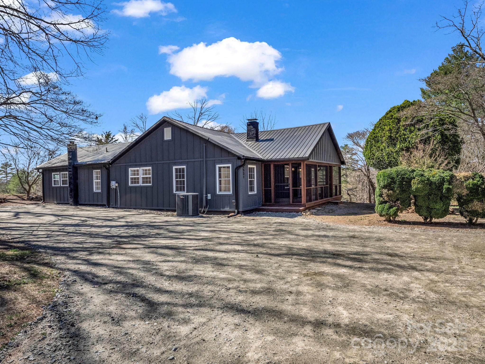 3531 Big Level Road Mill Spring, NC 28756 - Photo 24 of 29 a front view of a house with a garden