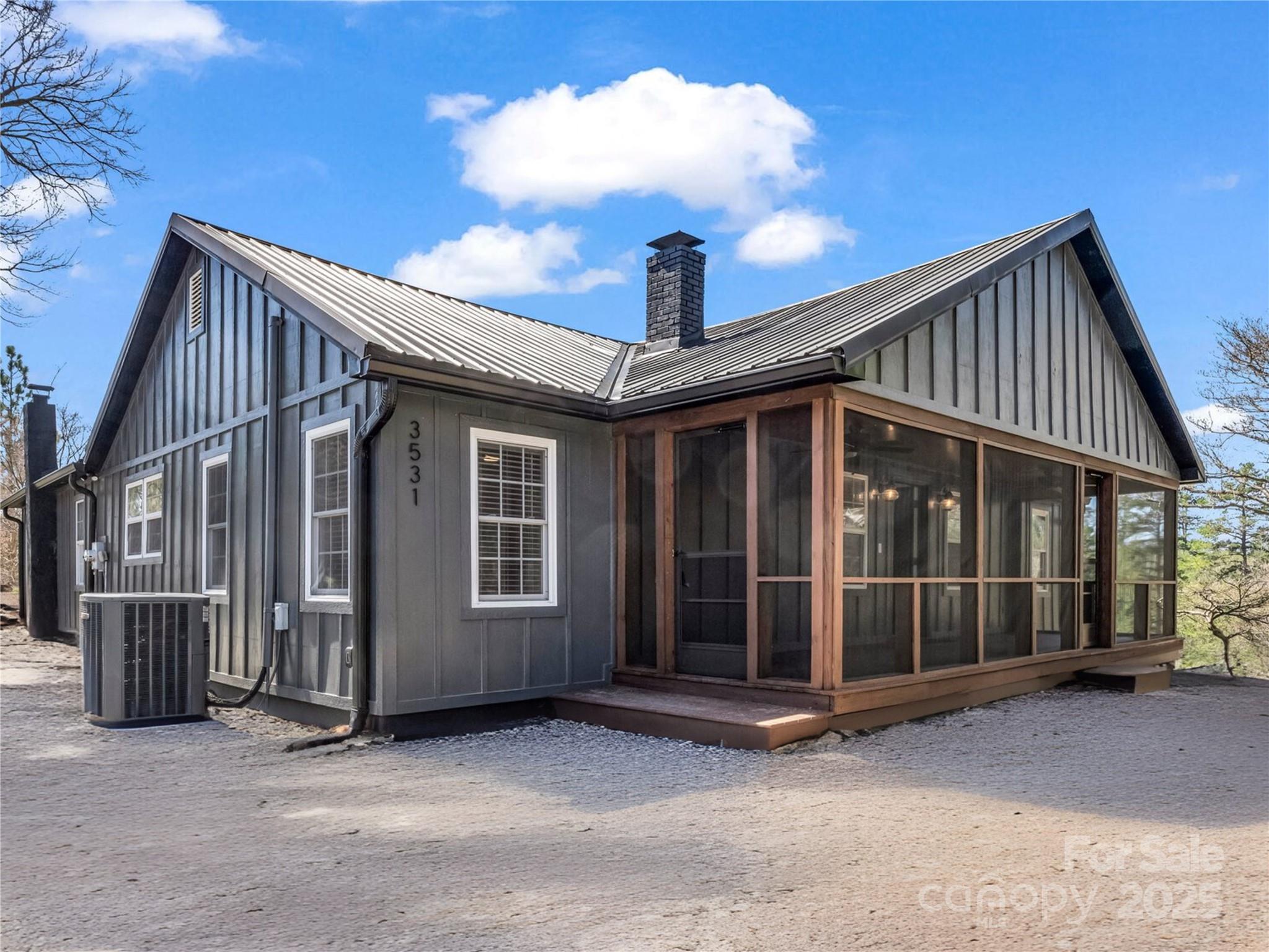 3531 Big Level Road Mill Spring, NC 28756 - Photo 25 of 29 a view of a house with a parking space and windows