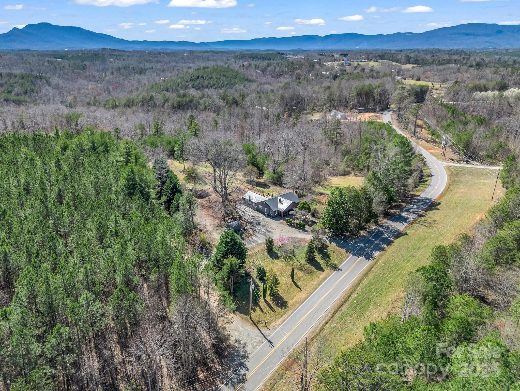3531 Big Level Road Mill Spring, NC 28756 - Photo 28 of 29 a view of a lake with a mountain in the background