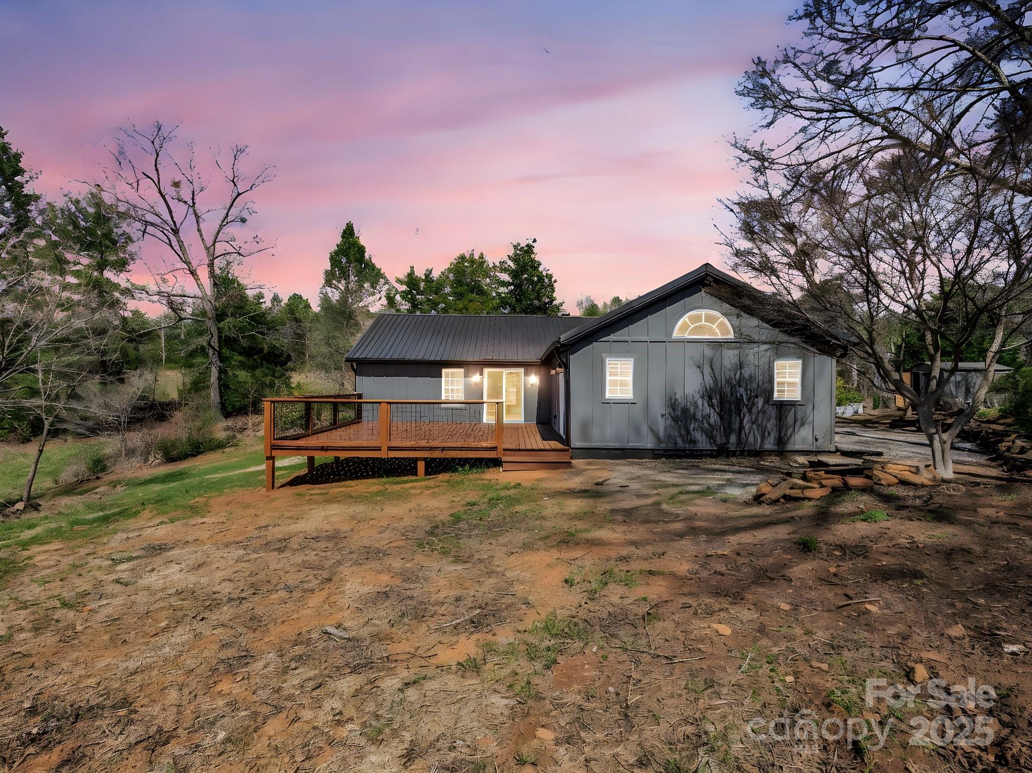 3531 Big Level Road Mill Spring, NC 28756 - Photo 3 of 29 a house with trees in the background
