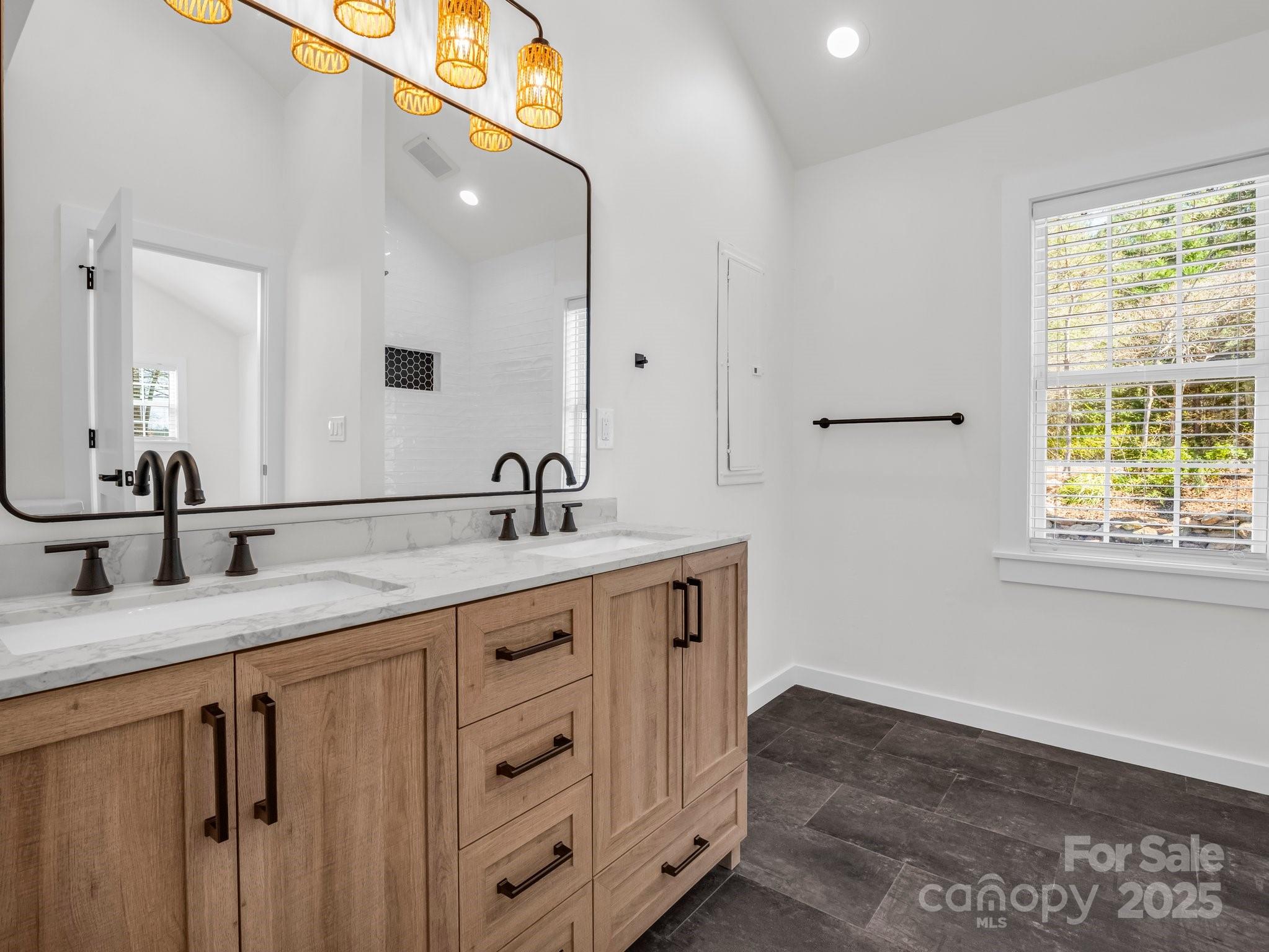 3531 Big Level Road Mill Spring, NC 28756 - Photo 9 of 29 a bathroom with a sink and a mirror