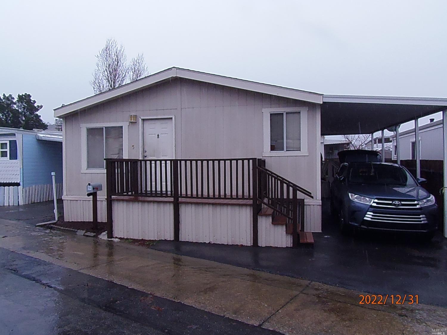 a view of outdoor space with porch and wooden floor