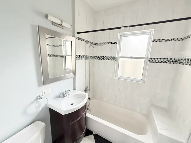 a bathroom with a sink and a bathtub