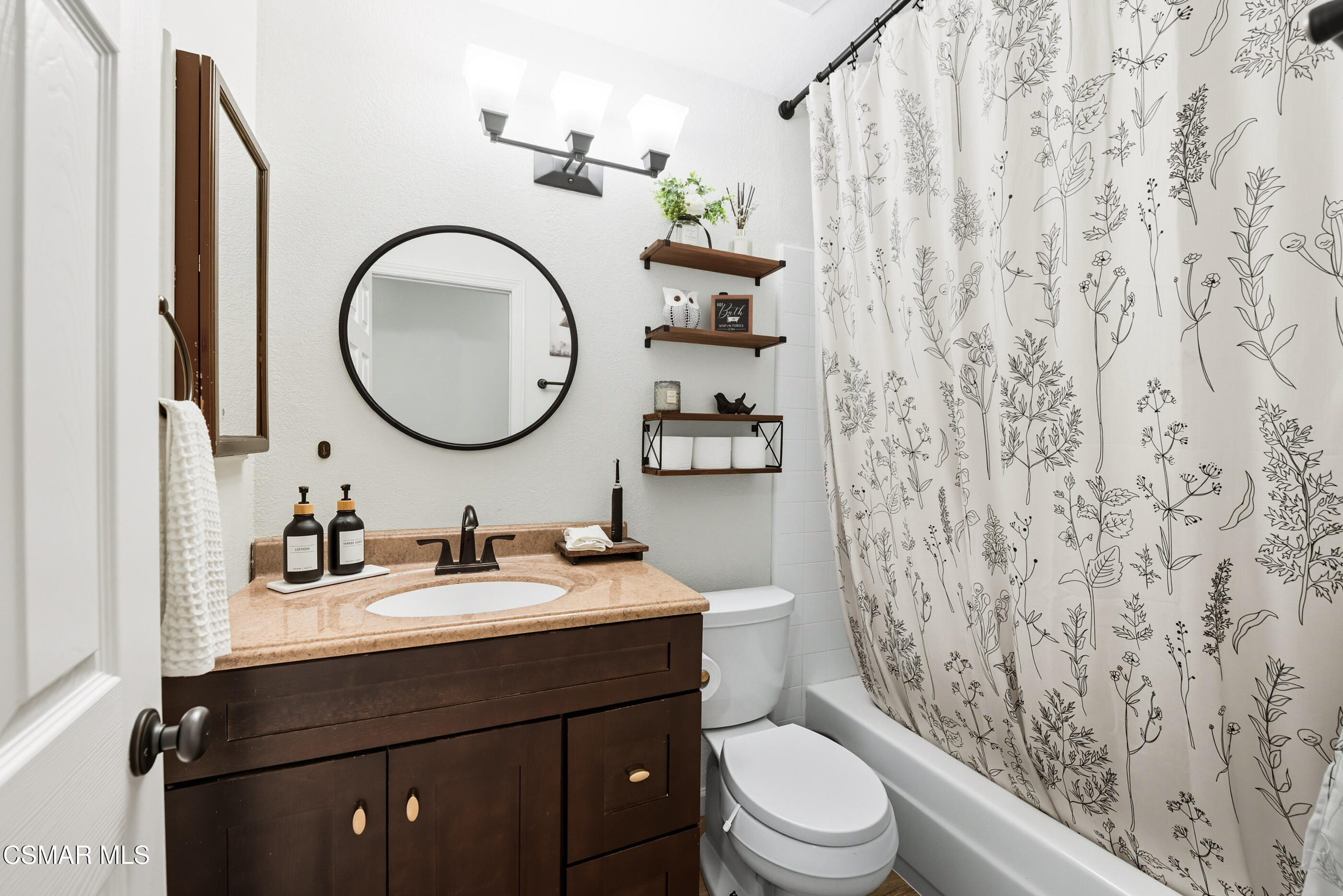 5474 Geoffrey Avenue Simi Valley, CA 93063 - Photo 22 of 38 a bathroom with a sink a toilet and a mirror