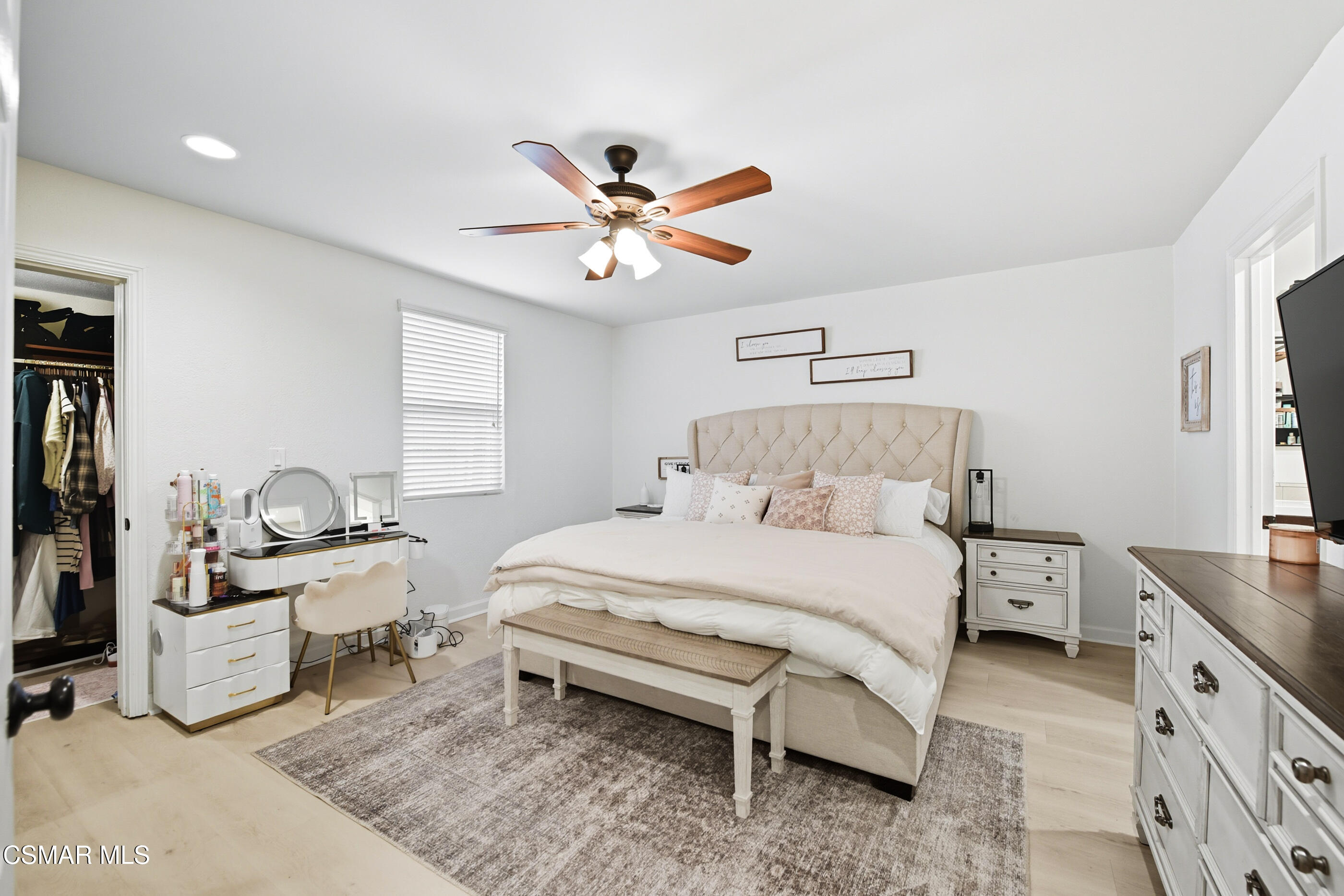 5474 Geoffrey Avenue Simi Valley, CA 93063 - Photo 23 of 38 a bed room with a bed and a chandelier