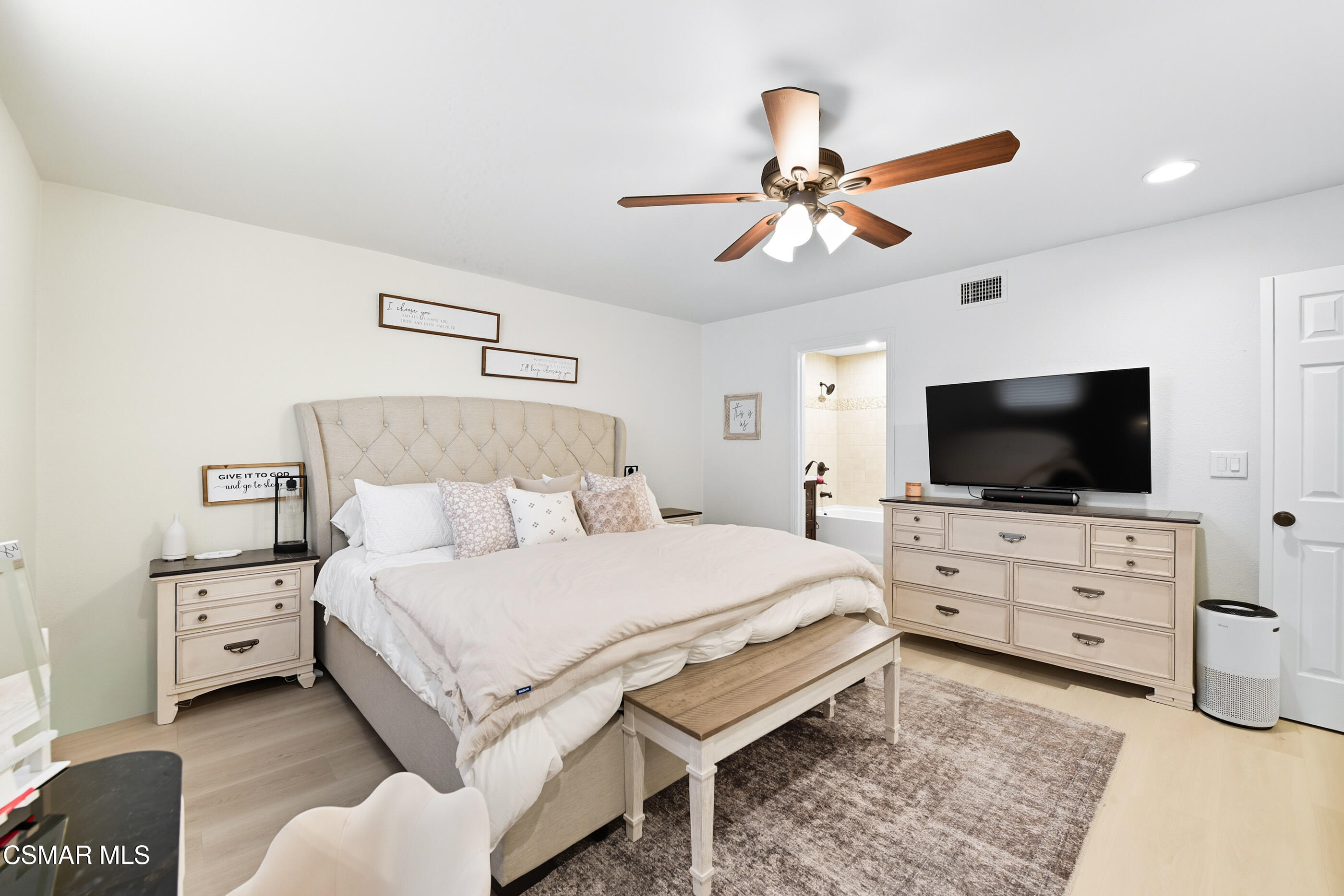 5474 Geoffrey Avenue Simi Valley, CA 93063 - Photo 24 of 38 a bedroom with a bed and a flat screen tv