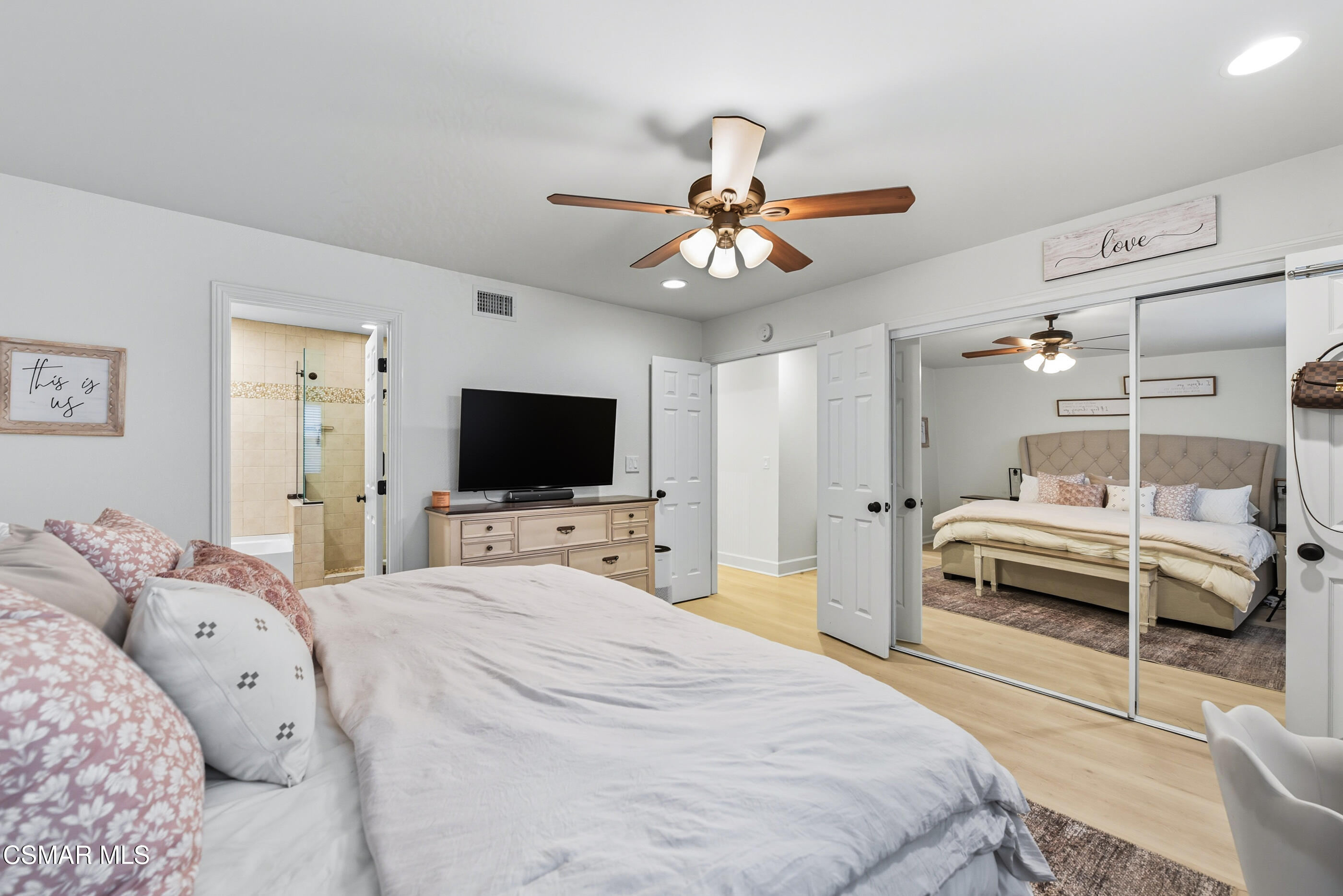 5474 Geoffrey Avenue Simi Valley, CA 93063 - Photo 25 of 38 a bedroom with a bed and a flat screen tv