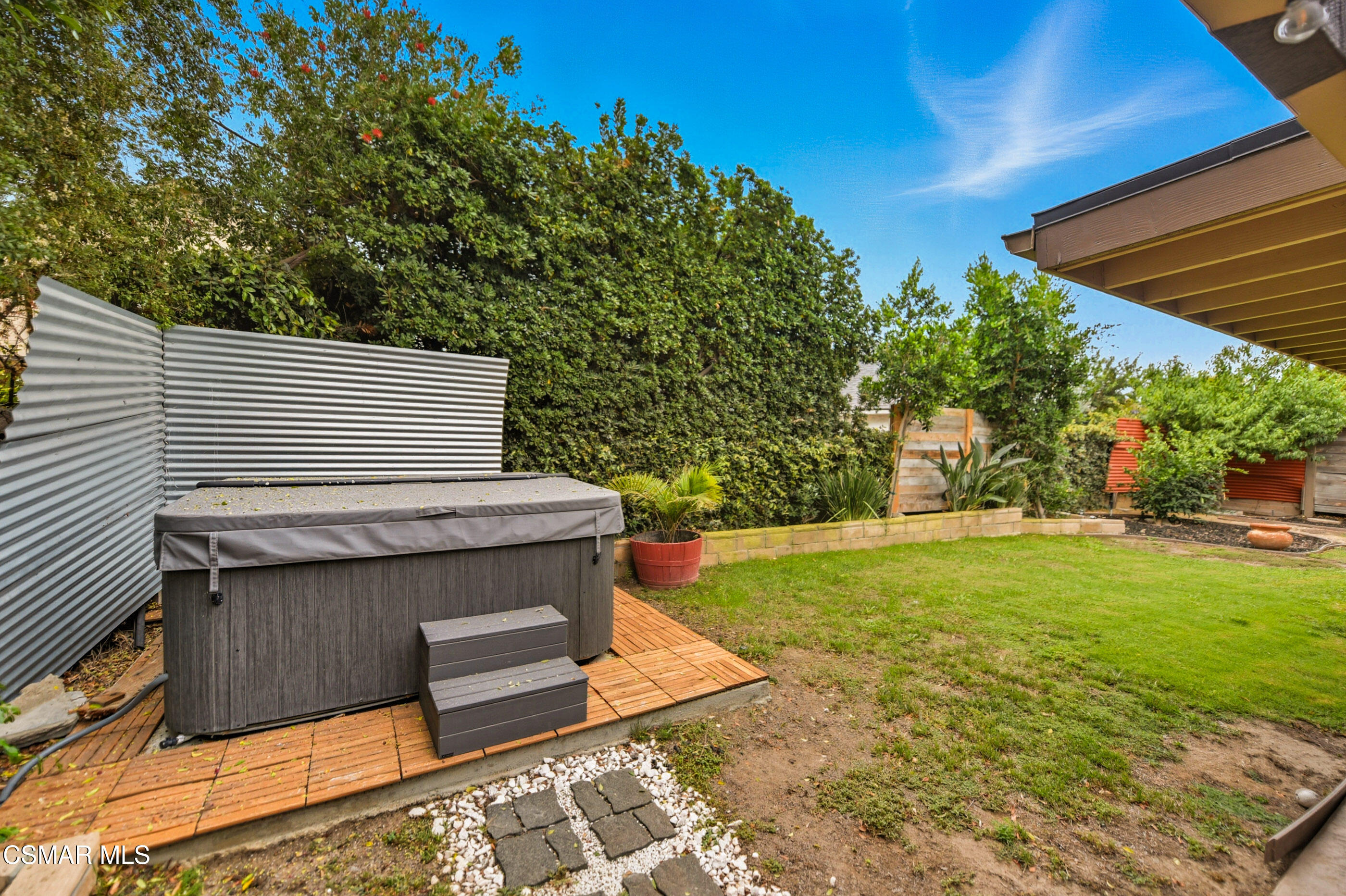 5474 Geoffrey Avenue Simi Valley, CA 93063 - Photo 31 of 38 a view of a backyard with plants and a patio