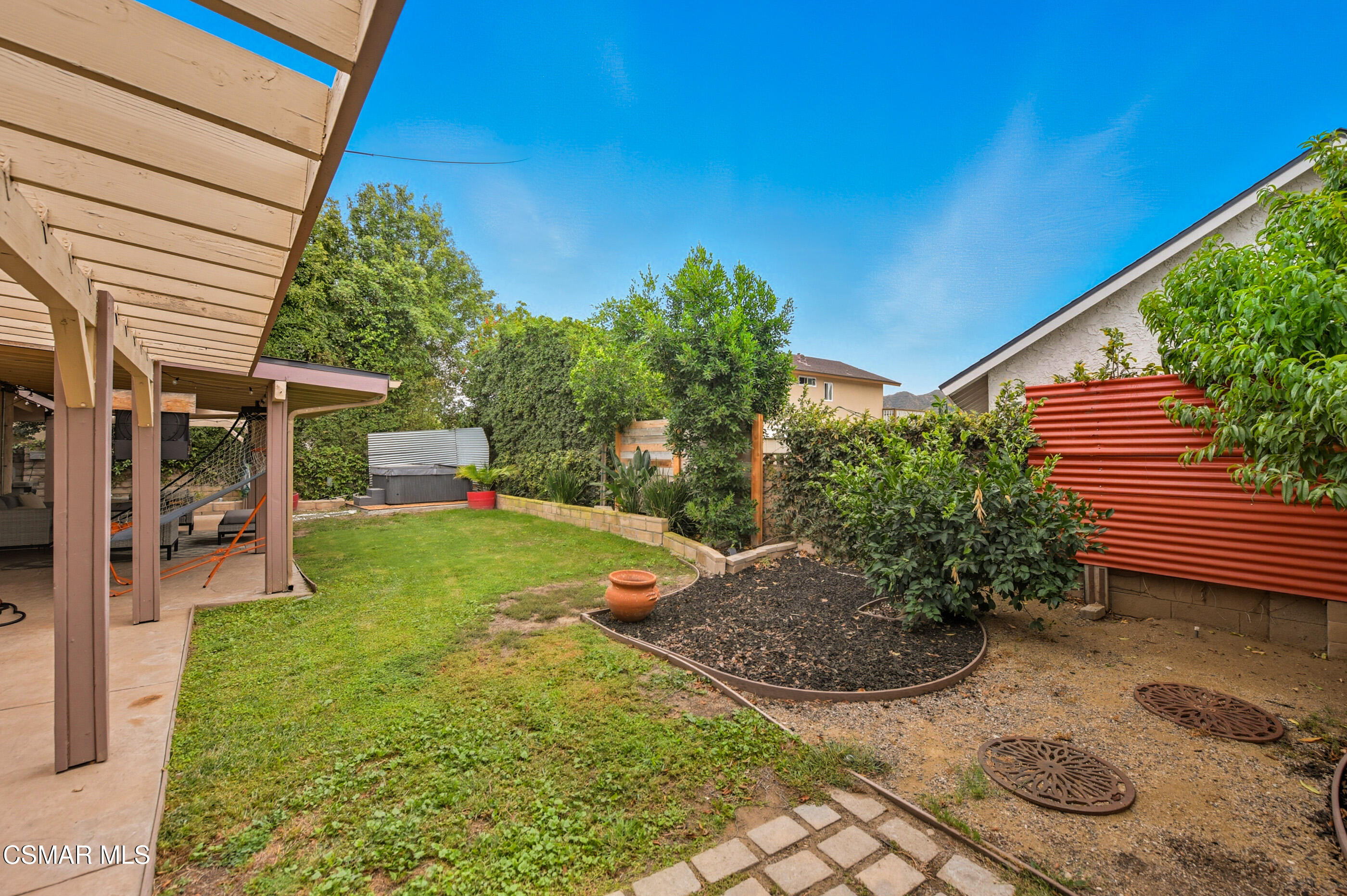 5474 Geoffrey Avenue Simi Valley, CA 93063 - Photo 35 of 38 a view of a backyard with plants and a patio