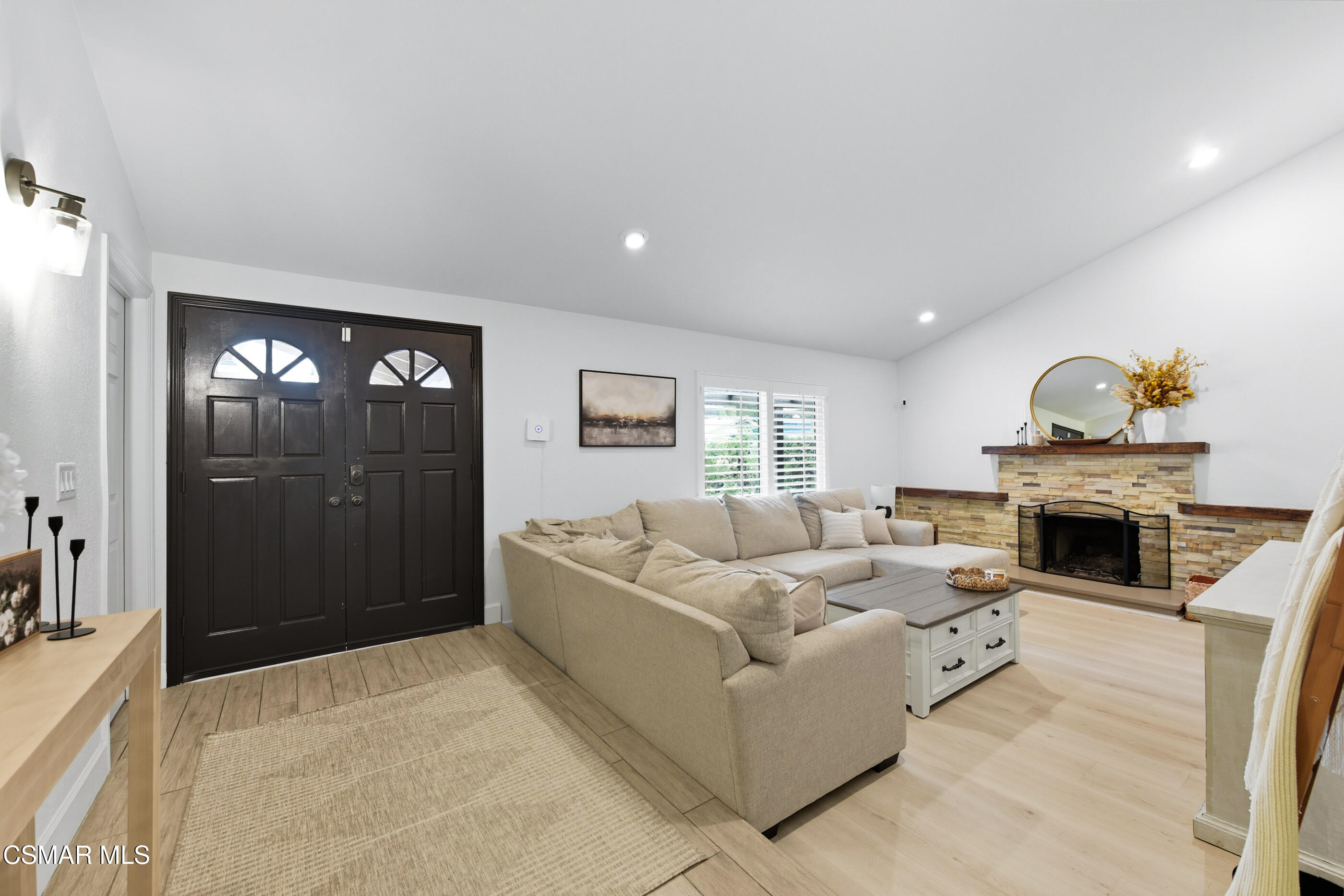 5474 Geoffrey Avenue Simi Valley, CA 93063 - Photo 6 of 38 a living room with furniture and a fireplace