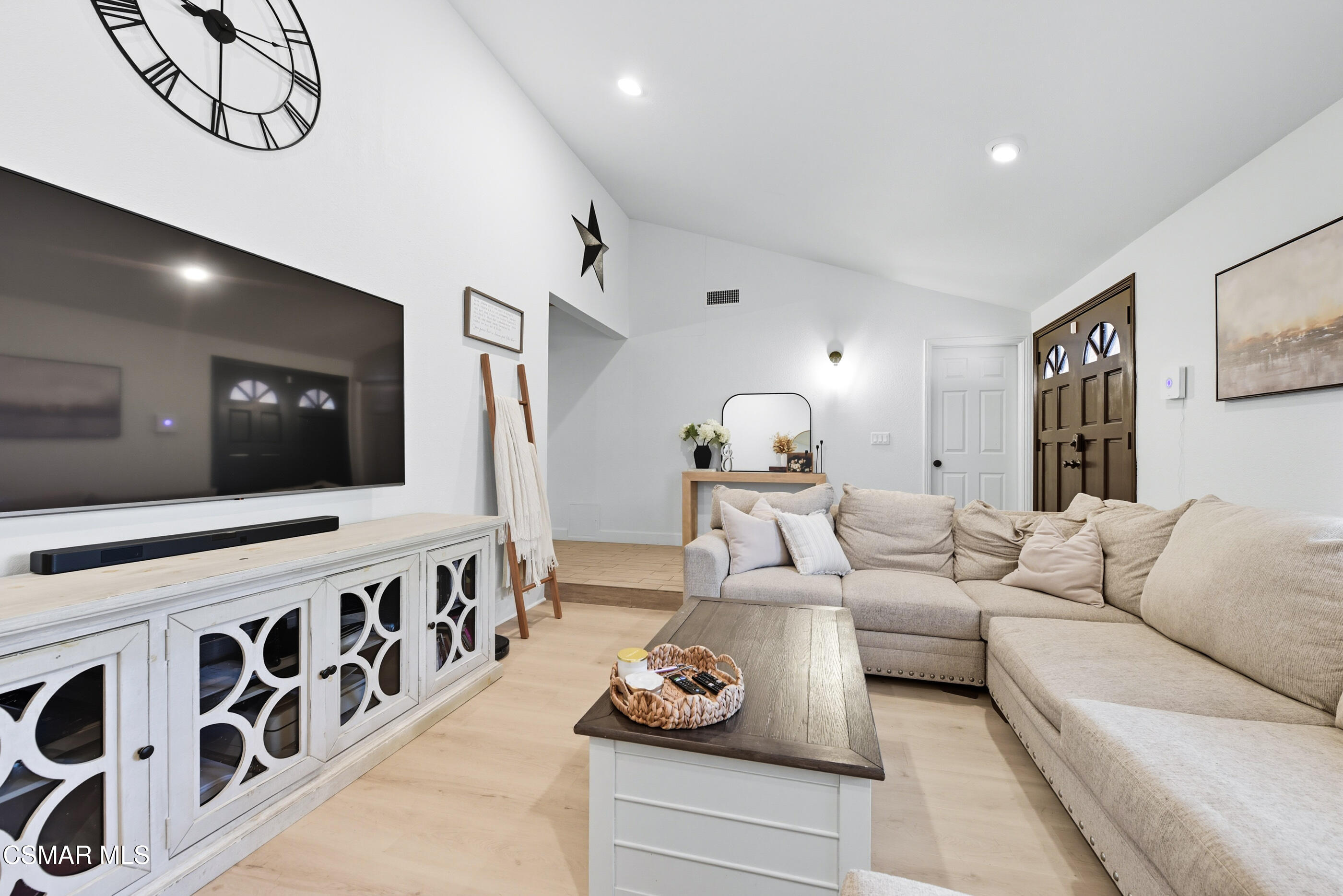5474 Geoffrey Avenue Simi Valley, CA 93063 - Photo 9 of 38 a living room with furniture and a flat screen tv