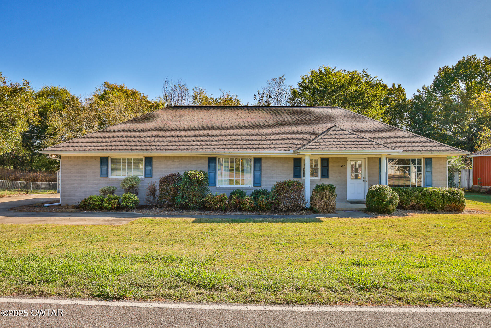 707 North Main Street Dyer, TN 38330 - Photo 3 of 29 a front view of a house with yard