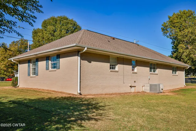 a backyard of a house with wooden fence