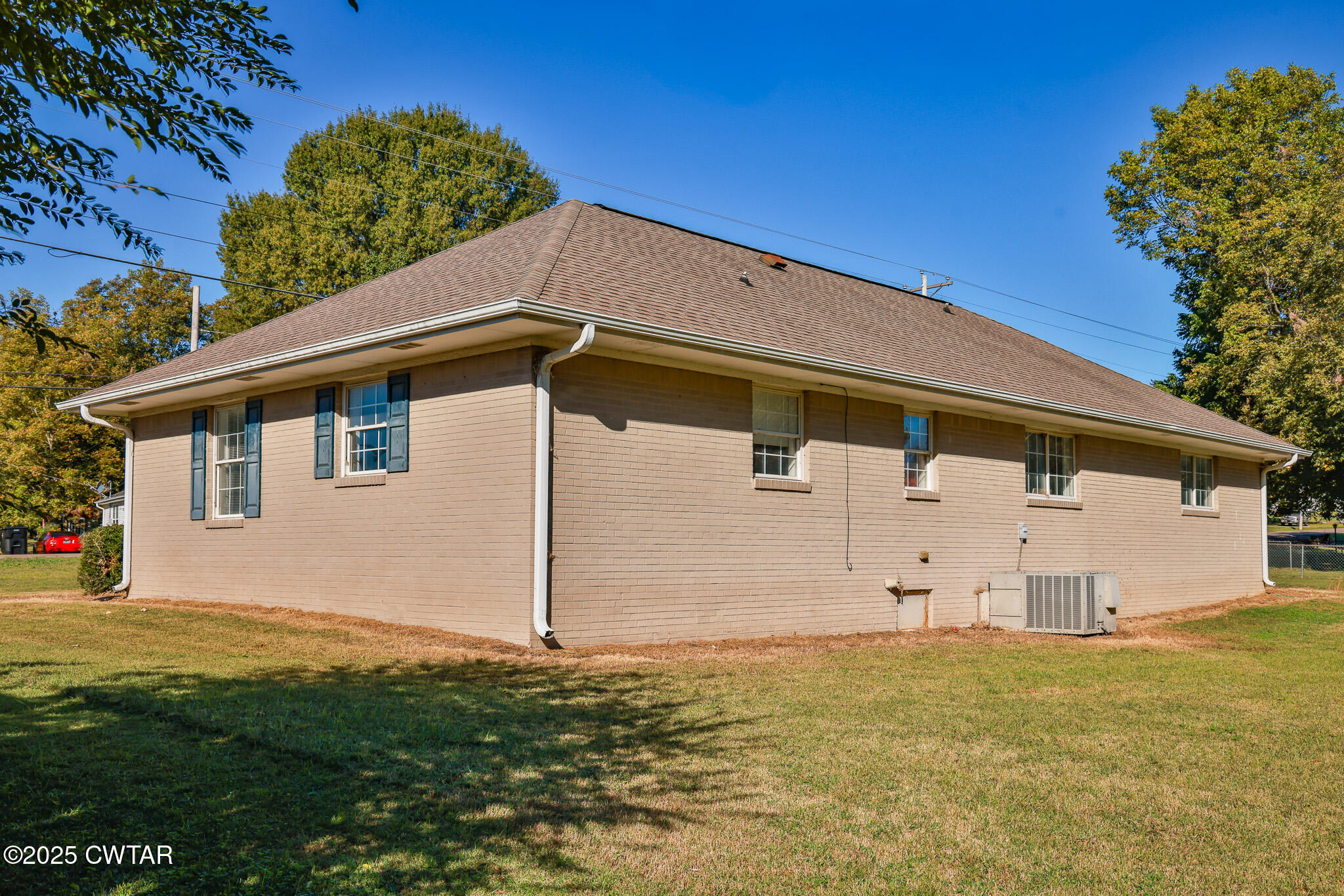 707 North Main Street Dyer, TN 38330 - Photo 8 of 29 a backyard of a house with wooden fence