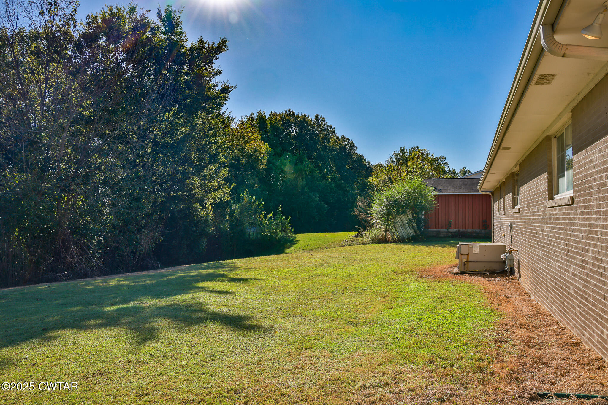 707 North Main Street Dyer, TN 38330 - Photo 10 of 29 a backyard of a house with lots of green space