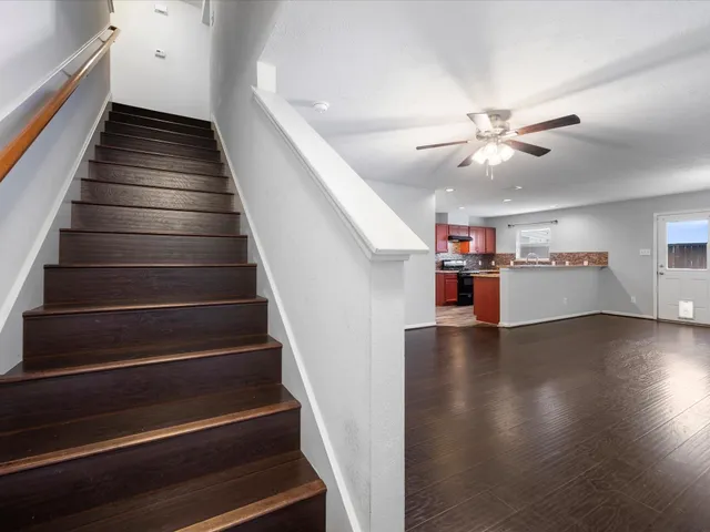 a view of entryway and hall with wooden floor