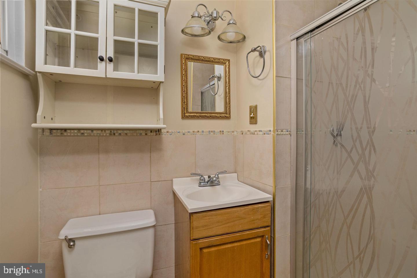 2 Great Oak Road Hamilton, NJ 08690 - Photo 5 of 15 a bathroom with a granite countertop toilet a sink and a mirror