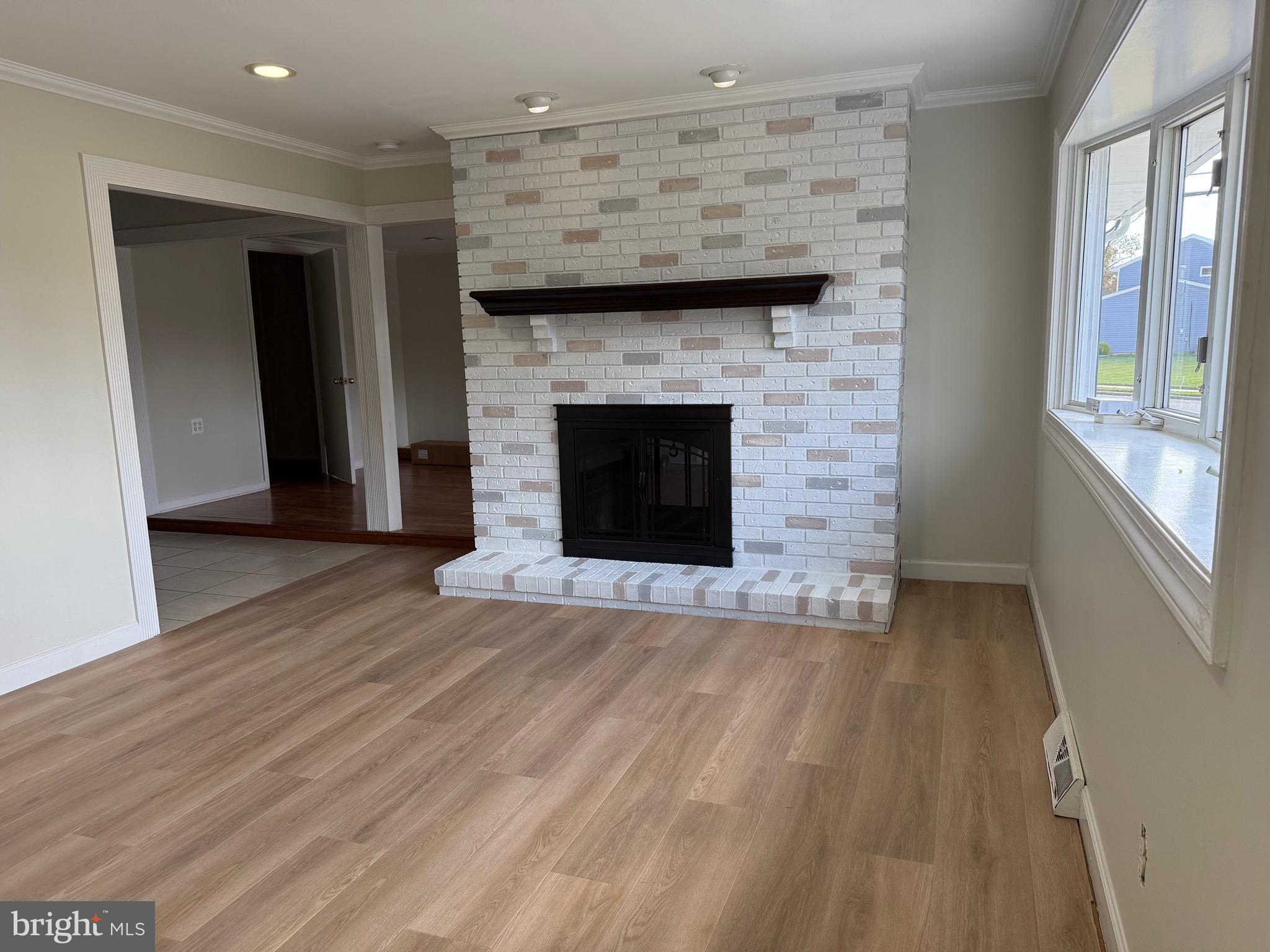 2 Great Oak Road Hamilton, NJ 08690 - Photo 10 of 15 a view of a livingroom with wooden floor and a fireplace