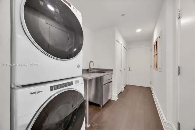 a view of a hallway with washer and dryer