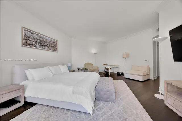 a large bathroom with a large mirror vanity and shower