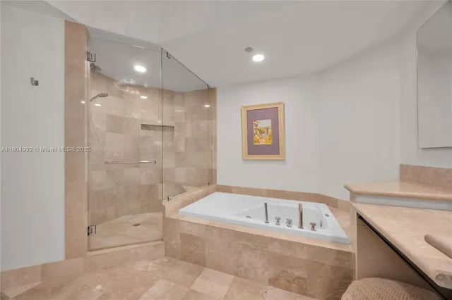 a spacious bedroom with a bed and a large window